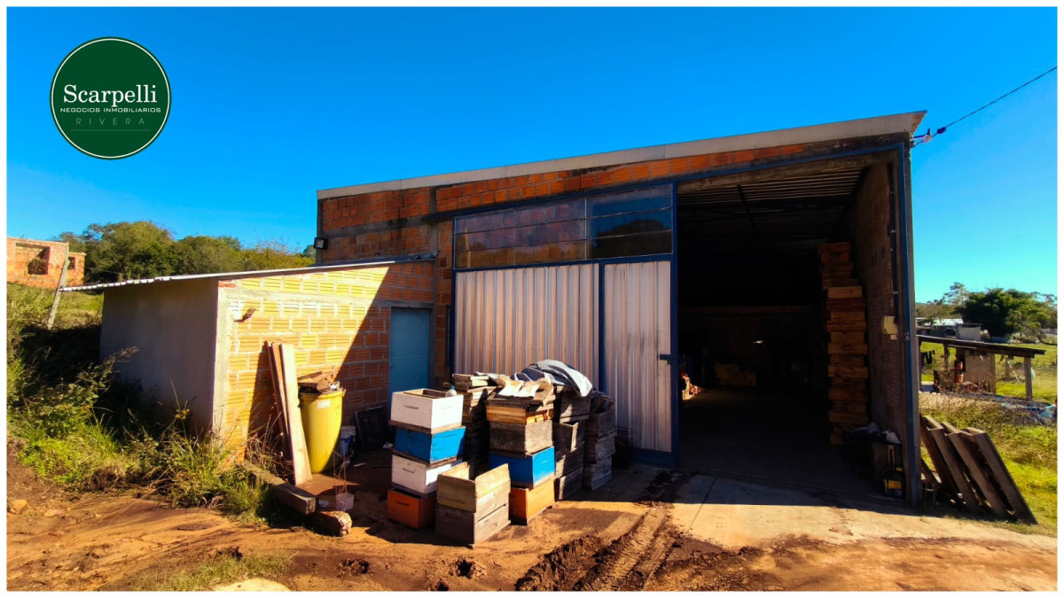 Terreno con Vivienda y amplio Depósito